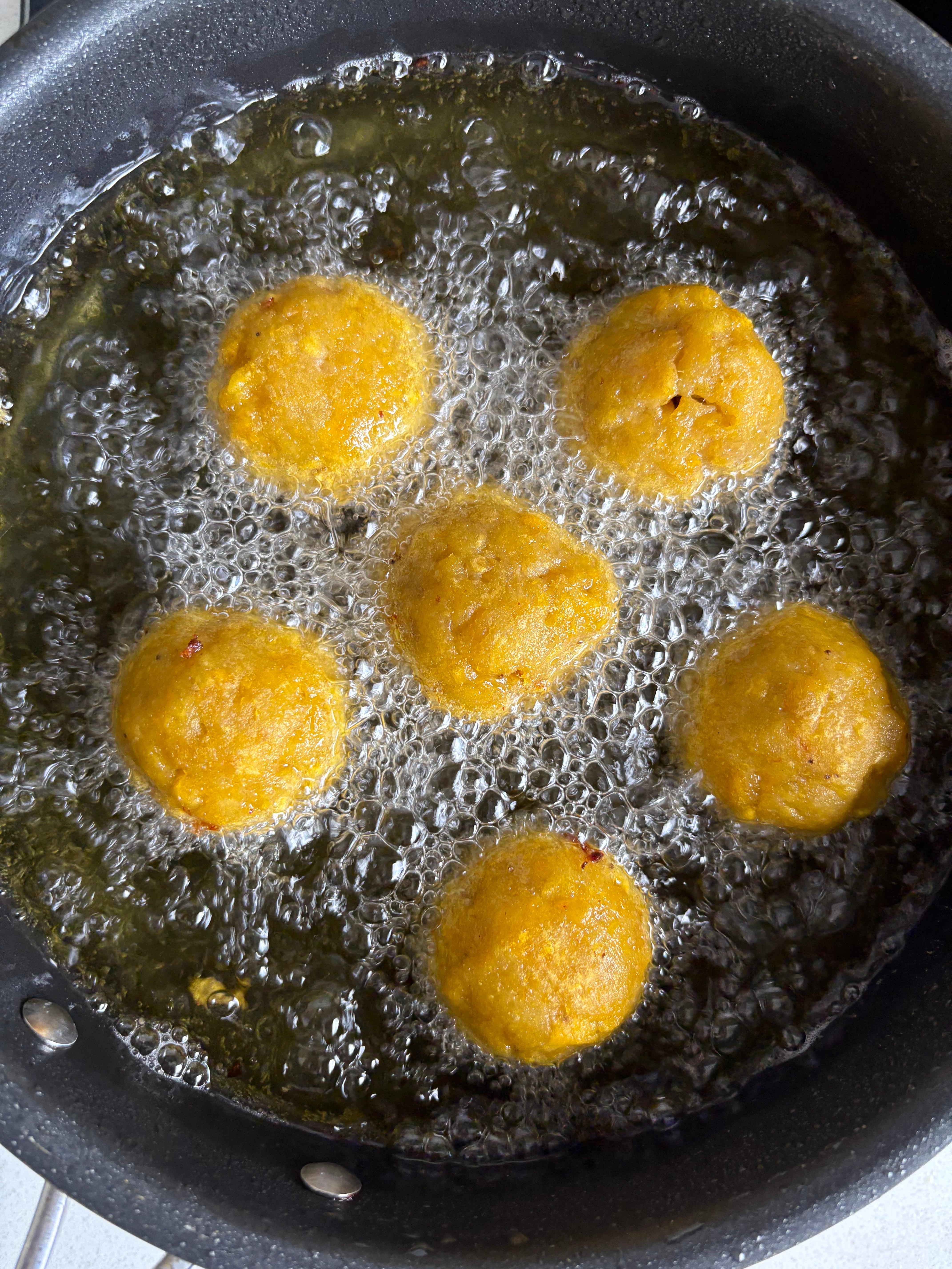 Bunuelos frying in oil